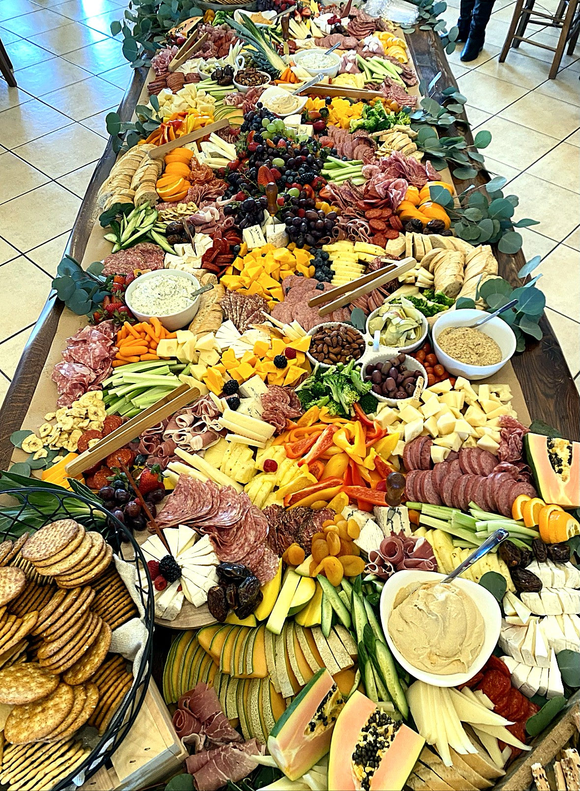 Long grazing table by LoveLe Sweets — meats, cheeses, fruit, vegetables, dips and crackers
