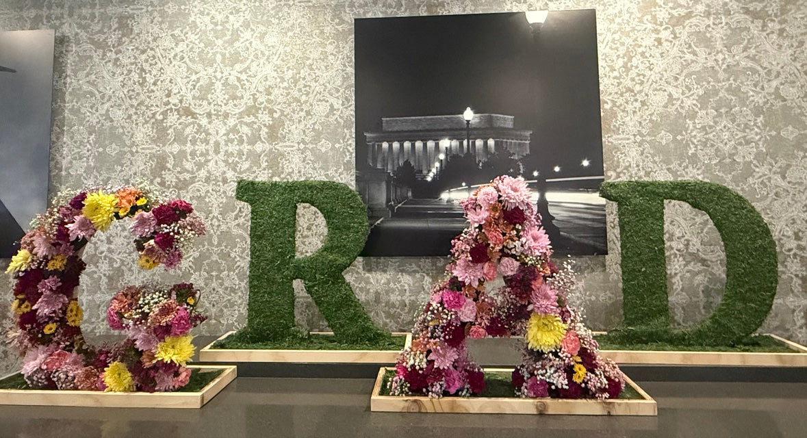 Floral letters spelling GRAD — custom event design by LoveLe Sweets